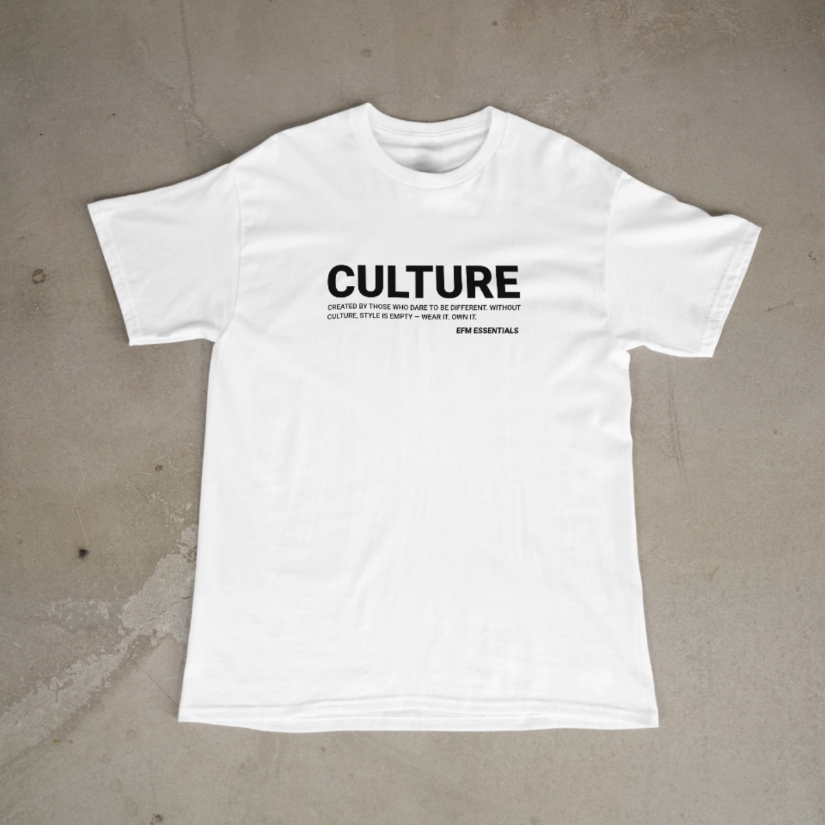 White t-shirt with black text on a beige background