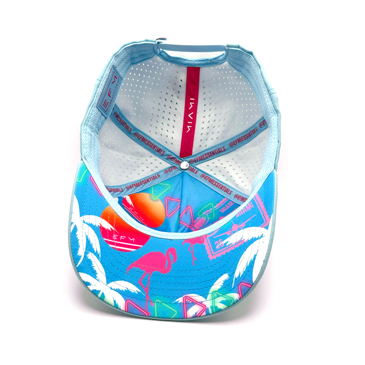 Colorful cap with flamingo and palm tree design on a white background