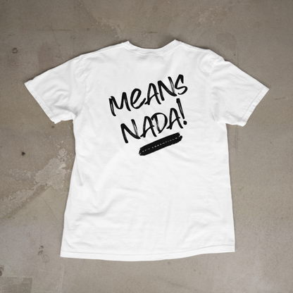 White t-shirt with black text 'MEANS NADA!' on a concrete floor.