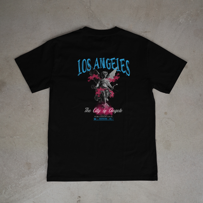 Black t-shirt with 'Los Angeles' and angel graphic on a gray surface