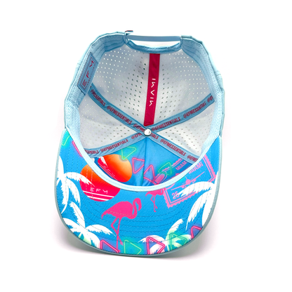 Colorful cap with flamingo and palm tree design on a white background