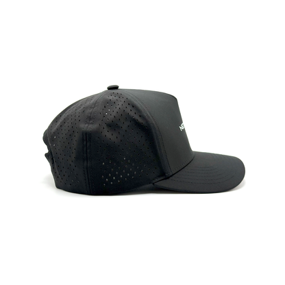 Black cap with perforated design on a white background